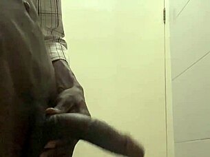 guy caught stroking huge cock in office bathroom