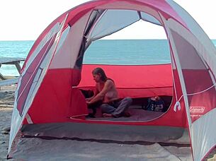 Milf housewife teases at the beach