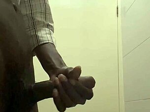 guy caught stroking huge cock in office bathroom