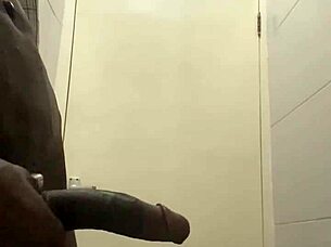 guy caught stroking huge cock in office bathroom