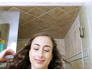 brunette model indulges in a relaxing sensual bath