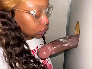 Ebony bbw throats stranger's monster bbc at gloryhole