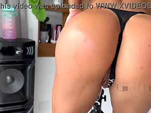 Pedaling hard while teasing with vibrating toy in sexy lingerie