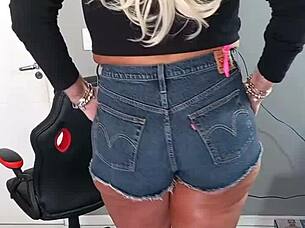 Tanned Beauty Poses in Tight Shorts Revealing Subtle Tan Lines