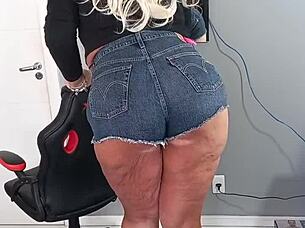 Tanned Beauty Poses in Tight Shorts Revealing Subtle Tan Lines