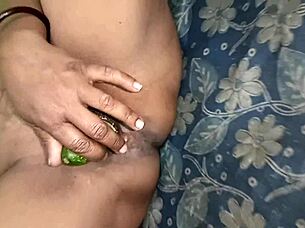 Indian milf, moan as cucumber drills your hairy pussy?