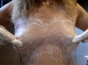 kinky milf stretches extreme pierced nipples close up rings?
