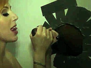 Redheaded whore sucks big black cock gloryhole creampie