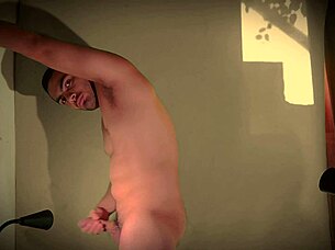 check out this sexy muscled guy jerking his huge cock against the wall