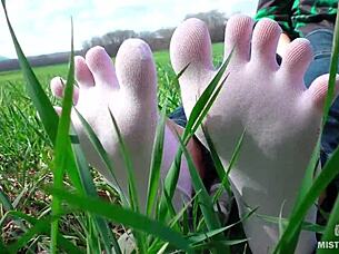 goddess's cute white socks feet tease in jeans on spring grass outdoors 👣😍