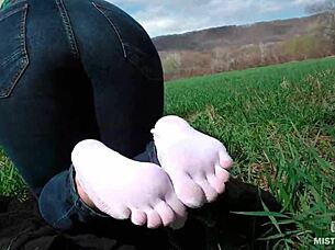 goddess's cute white socks feet tease in jeans on spring grass outdoors 👣😍