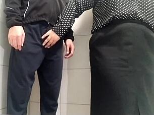 Gorgeous milf's public toilet handjob drives me wild with lust