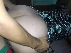 Setting tripod for naughty doggy in floral dress