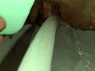 Gretala's Slick Soap Teases Her Smooth Trimmed Pussy Close-Up