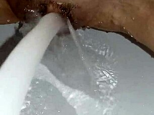 Gretala's Slick Soap Teases Her Smooth Trimmed Pussy Close-Up