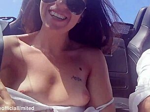 Naughty brunette flashes small tits pussy from topless sports car publicly