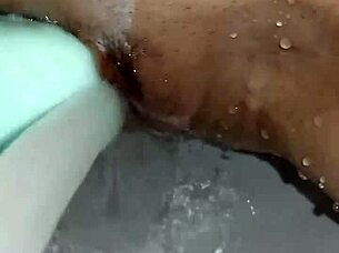 Gretala's Slick Soap Teases Her Smooth Trimmed Pussy Close-Up