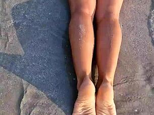 Petite beauty flashes sexy white bikini on beach publicly