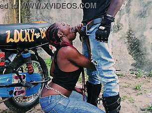 petite biker babe stands for public garage sex on bike with her man