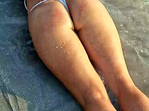 Petite beauty flashes sexy white bikini on beach publicly