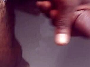Hey, check out this black babe showering and masturbating her big tits