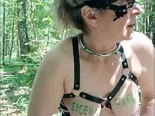 french slave milf flashes tits in forest for dogging piss and deepthroat cum