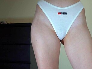 sexy schoolgirl model tries cotton panties over hairy pussy lips