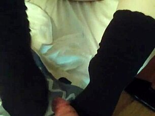 chubby girl strokes huge cock in socks foot fetish play