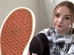 Serbian girl slips off sneakers revealing bare feet