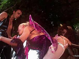 Outdoor threesome between two guys in costumes and a horny cock sucking blonde milf