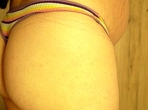 Pregnant babe wears gloves and rubs her camel toe to orgasm