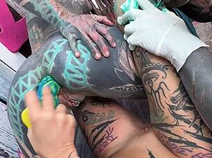 Naughty tattooed girl uses toy