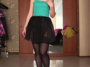 a gorgeous ass tries on short skirts and changes in front of mirror