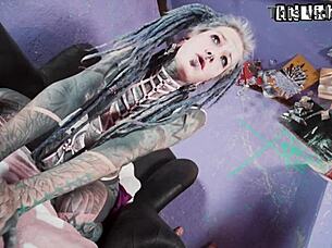 tattooed model teases with anal toys