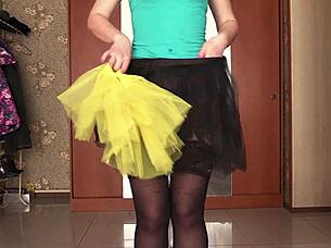 a gorgeous ass tries on short skirts and changes in front of mirror