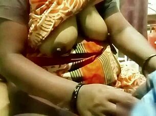 indian aunty gives handjob to young guy at home