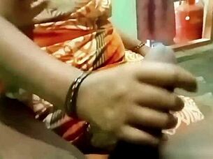 indian aunty gives handjob to young guy at home