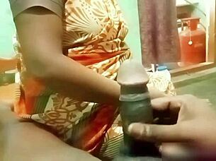 indian aunty gives handjob to young guy at home