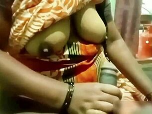 indian aunty gives handjob to young guy at home
