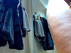 masturbating while trying clothes in public room