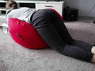 Nerdy girl rides yoga ball
