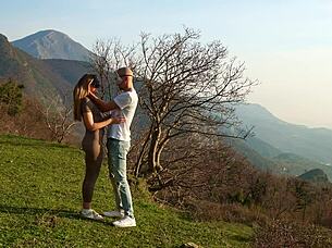 horny couple making love on a wild mountain meadow