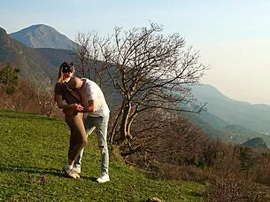 horny couple making love on a wild mountain meadow