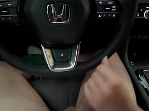 She sucks and plays while driving through the city