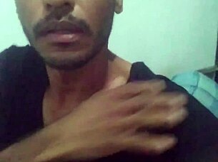 muscular guy strokes his cock hard