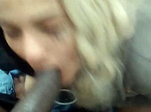 Young woman takes large black man deeply