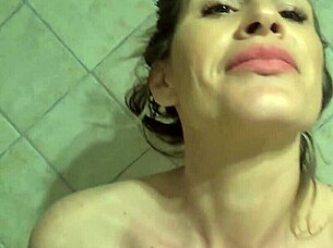 Milf squirts during orgasm in shower bathing.