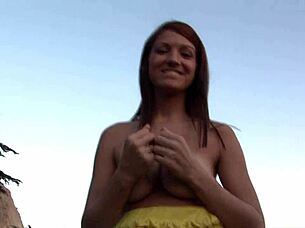 Redhead teen enjoys beach day in public