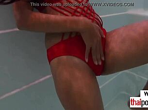 An Asian European couple enjoys pool fun and gets excited afterward.