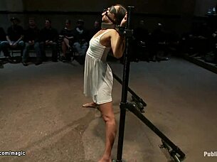 bound slave endures rough treatment in public